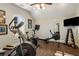 Home gym with various exercise equipment including elliptical and rower at 571 Glen Eagles Se Cir, Marietta, GA 30067