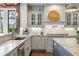 Modern kitchen with white cabinets, granite countertops, and stainless steel appliances at 571 Glen Eagles Se Cir, Marietta, GA 30067