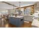Open concept kitchen with island, custom cabinetry, and views to the Gathering room at 571 Glen Eagles Se Cir, Marietta, GA 30067