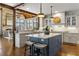 Gourmet kitchen boasts an island, custom cabinetry, and granite countertops at 571 Glen Eagles Se Cir, Marietta, GA 30067
