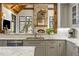 Kitchen features granite countertops, stainless steel appliances, and a view of the fireplace at 571 Glen Eagles Se Cir, Marietta, GA 30067