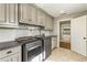 Bright laundry room featuring shaker cabinets and ample counter space at 571 Glen Eagles Se Cir, Marietta, GA 30067