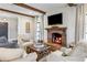 Living room with fireplace, hardwood floors, and large windows at 571 Glen Eagles Se Cir, Marietta, GA 30067