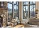 Cozy sitting area near a stone fireplace with a view of the backyard at 571 Glen Eagles Se Cir, Marietta, GA 30067