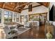 Spacious living room with high ceilings, exposed beams, and large windows at 571 Glen Eagles Se Cir, Marietta, GA 30067