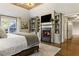 Main bedroom featuring a fireplace and built-in shelving at 571 Glen Eagles Se Cir, Marietta, GA 30067
