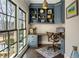 Home office with built-in shelving, desk, and large windows at 571 Glen Eagles Se Cir, Marietta, GA 30067