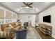 Spacious sitting room featuring a comfortable couch and plenty of natural light at 571 Glen Eagles Se Cir, Marietta, GA 30067
