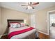 Bedroom with ceiling fan and hardwood floors at 156 Main St, Lilburn, GA 30047