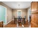 Cozy dining area with wood floors and a chandelier at 156 Main St, Lilburn, GA 30047