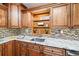 Granite countertops and wood cabinets in the updated kitchen at 156 Main St, Lilburn, GA 30047