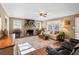 Bright living room featuring hardwood floors and a stone fireplace at 156 Main St, Lilburn, GA 30047