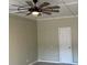 Spacious bedroom with ceiling fan and white door at 175 Brown Rd, Stockbridge, GA 30281