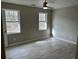 Well-lit bedroom with two windows and wood floors at 175 Brown Rd, Stockbridge, GA 30281