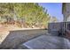 Fenced backyard featuring a concrete patio and a view of lush trees at 177 Oakland Hills Way, Lawrenceville, GA 30044