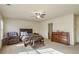 Well-lit bedroom with comfortable furniture, soft carpet, and a ceiling fan at 177 Oakland Hills Way, Lawrenceville, GA 30044