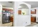 Modern kitchen with stainless steel appliances, tile flooring, and ample counter space at 177 Oakland Hills Way, Lawrenceville, GA 30044