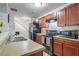 Galley-style kitchen with stainless steel appliances at 177 Oakland Hills Way, Lawrenceville, GA 30044