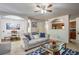 Spacious living room showcasing a comfortable seating area, ceiling fan, and open layout at 177 Oakland Hills Way, Lawrenceville, GA 30044