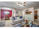 Open concept living room flowing into dining and kitchen areas, creating a seamless entertaining space at 177 Oakland Hills Way, Lawrenceville, GA 30044