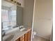 Bathroom features a double vanity and large mirror at 2800 Camelot Woods Dr, Lawrenceville, GA 30044