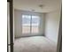 Bedroom with carpet and a window with a view of the outdoors at 2800 Camelot Woods Dr, Lawrenceville, GA 30044