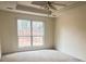 Spacious main bedroom with tray ceiling and fan at 2800 Camelot Woods Dr, Lawrenceville, GA 30044