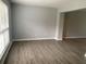 Simple dining area with neutral walls and wood-look flooring at 3730 Oak Park Dr, Suwanee, GA 30024