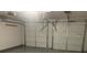 Two-car garage with automatic door openers and epoxy floor at 3730 Oak Park Dr, Suwanee, GA 30024