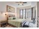 Spacious bedroom with large windows and a dresser at 565 Peachtree Ne St # 1303, Atlanta, GA 30308