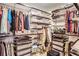 Large walk-in closet with ample shelving and hanging space at 565 Peachtree Ne St # 1303, Atlanta, GA 30308