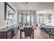 Elegant dining area with hardwood floors and a modern chandelier at 565 Peachtree Ne St # 1303, Atlanta, GA 30308