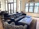 Relaxing living area featuring a sectional sofa and large windows at 565 Peachtree Ne St # 1303, Atlanta, GA 30308