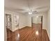 Large bedroom with hardwood floors, mirrored closet doors and bathroom access at 713 Cypress Pointe St, Alpharetta, GA 30022