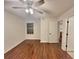 Spacious bedroom with wood floors and ceiling fan at 713 Cypress Pointe St, Alpharetta, GA 30022