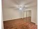 Well-lit bedroom featuring hardwood floors and a mirrored closet at 713 Cypress Pointe St, Alpharetta, GA 30022