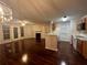 Kitchen with white appliances and hardwood floors at 713 Cypress Pointe St, Alpharetta, GA 30022