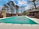 Community pool with cover, surrounded by trees and a gazebo at 713 Cypress Pointe St, Alpharetta, GA 30022