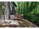 Private backyard patio with wooded views at 977 Fleetwood Cir, Atlanta, GA 30311