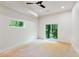 Unfinished basement room with sliding glass doors and large windows at 977 Fleetwood Cir, Atlanta, GA 30311