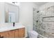 Contemporary bathroom with a walk-in shower and wood vanity at 977 Fleetwood Cir, Atlanta, GA 30311