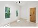 Unfinished bedroom with hardwood floors and large windows at 977 Fleetwood Cir, Atlanta, GA 30311