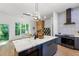 Modern kitchen with sleek gray cabinets, marble countertops and an island at 977 Fleetwood Cir, Atlanta, GA 30311