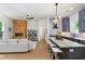 Open concept living space with kitchen, herringbone fireplace, and hardwood floors at 977 Fleetwood Cir, Atlanta, GA 30311