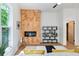 Living room with herringbone wall, fireplace, and built-in shelving at 977 Fleetwood Cir, Atlanta, GA 30311