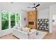 Living room features hardwood floors, herringbone fireplace, and large windows at 977 Fleetwood Cir, Atlanta, GA 30311