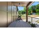 Covered porch with a wooden deck and metal railing, offering a relaxing outdoor space at 977 Fleetwood Cir, Atlanta, GA 30311