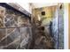 Spacious shower with marble tile and pebble floor at 977 Fleetwood Cir, Atlanta, GA 30311