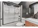 Modern bathroom with a shower/tub combo and dark accents at 1097 Dell Se Ave, Smyrna, GA 30080