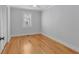 Well-lit bedroom with hardwood floors and neutral walls at 1097 Dell Se Ave, Smyrna, GA 30080